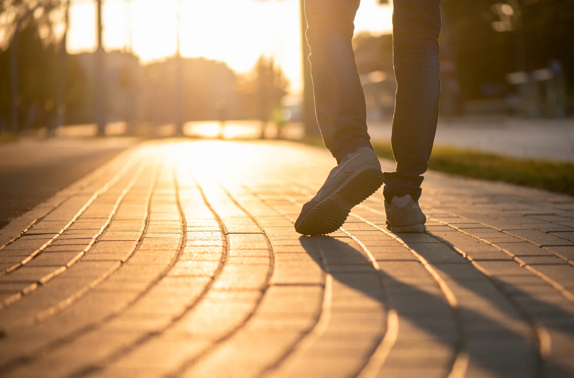 A relaxed person walking on a Long Island at sunset