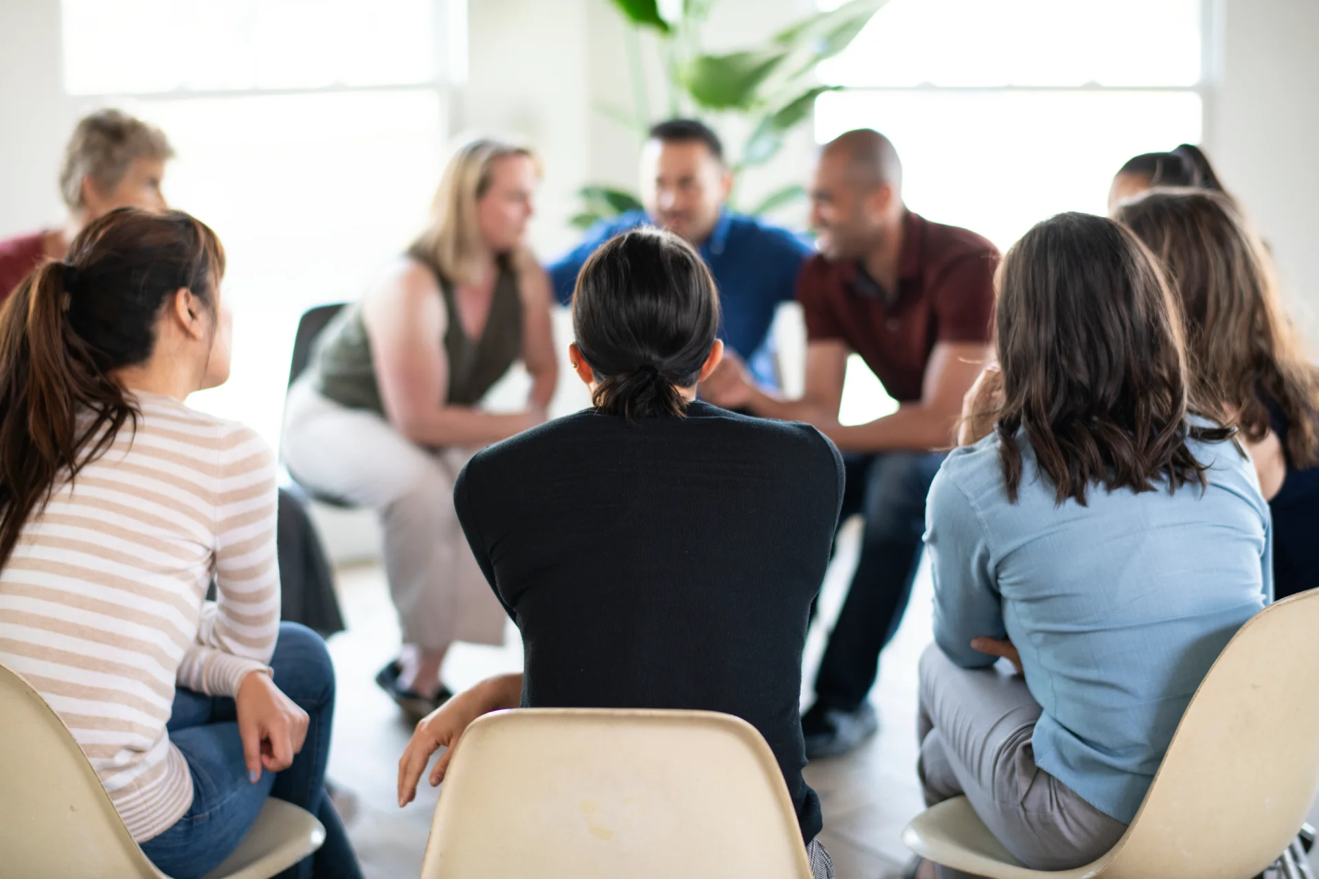 A professional therapy group meeting in a modern outpatient center