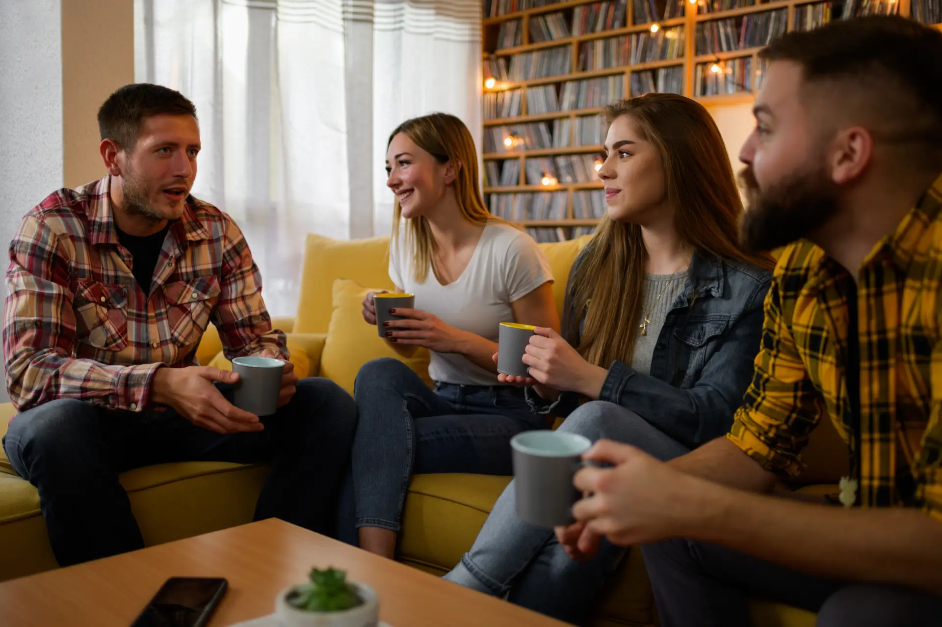 A supportive group meeting in a comfortable living room of a sober home, emphasizing stability and community.