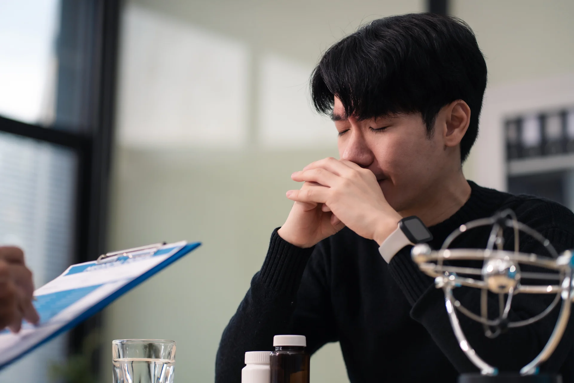 Patient in consultation while specialist explains the negative effects of his addiction.