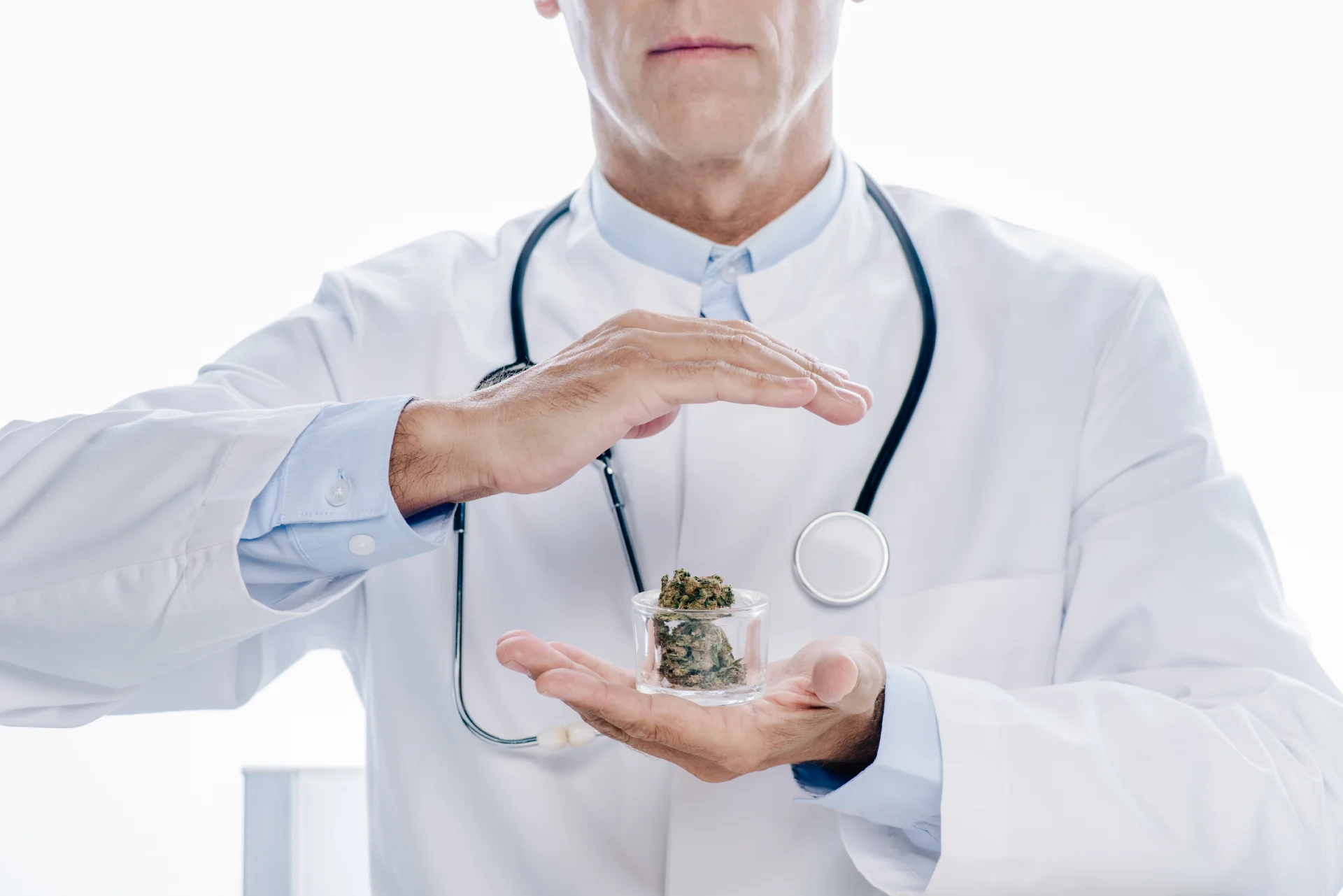 doctor with a jar of marijuana, explaining adverse effects